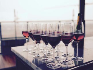 Wine Glass With Red Liquid on Black Table