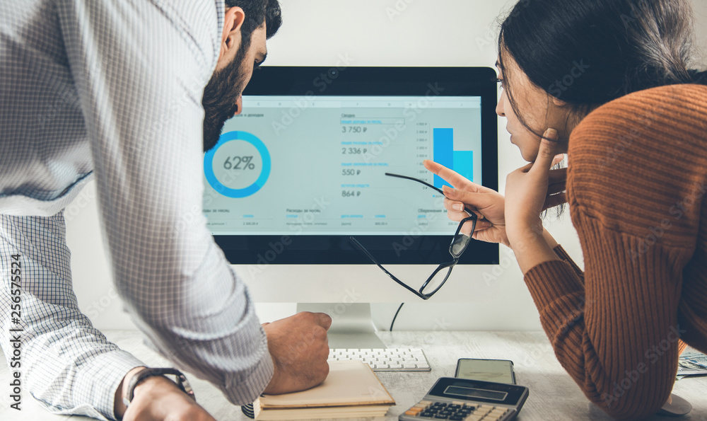 team working in graph on computer screen